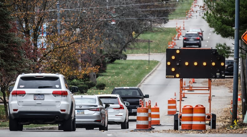 All lanes on Ohio 48, or Far Hills Avenue, in Oakwood are expected to reopen this week during a temporary pause in a sewer project that is behind schedule. JIM NOELKER/STAFF