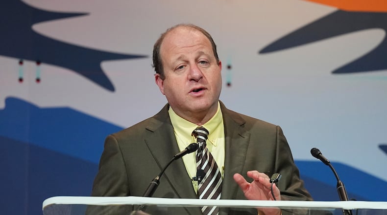 FILE - Colorado Gov. Jared Polis speaks to the National Governors Association at the Broadmoor Hotel in Colorado Springs, Colo., July 25, 2025. (AP Photo/David Zalubowski, File)