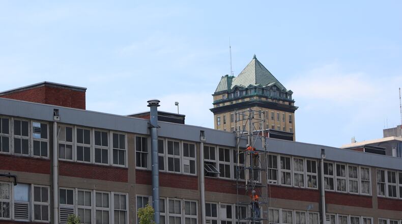 Crews work on the backside of the Huffman Block building on the 100 block of East Third Street. CORNELIUS FROLIK / STAFF