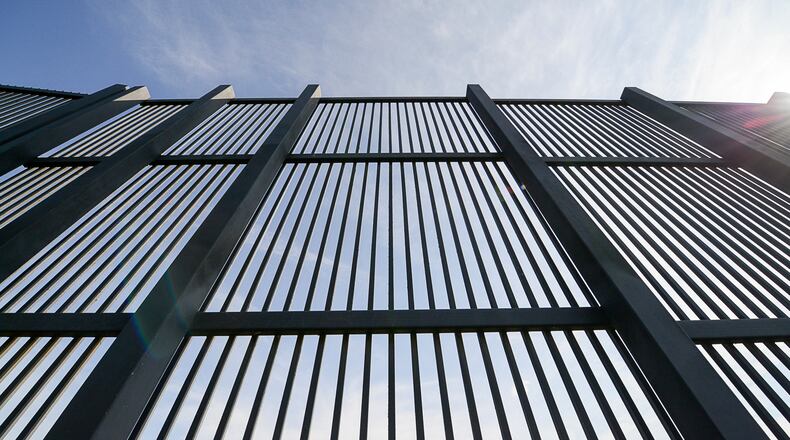 At least four Dayton-region companies have registered as interested vendors in the federal U.S.-Mexico border wall project. This file photo from February shows a section of the border fence along the U.S.-Mexico border in Brownsville, Texas. (Jason Hoekema/The Brownsville Herald via AP, File)