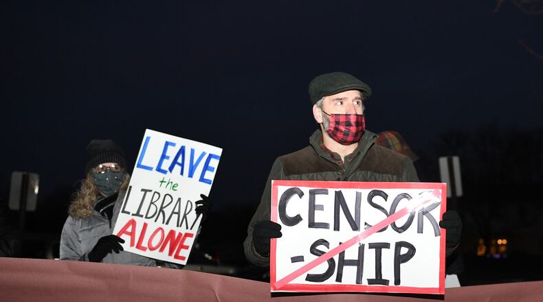 Library supporters on Tuesday, Dec. 9 protest outside the Tipp City board of education office.