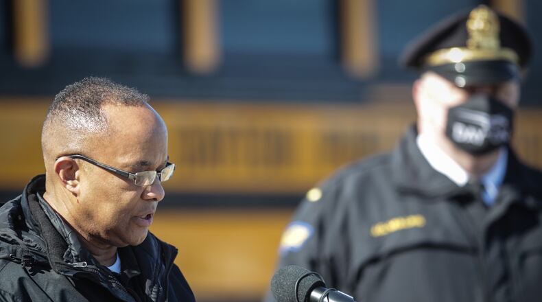 DPS Chief of Safety, Richard Wright II, left and Dayton Police Lt. James Mullins talked to the media Tuesday morning at Dunbar High School about Dayton students' return to in-person school next week.