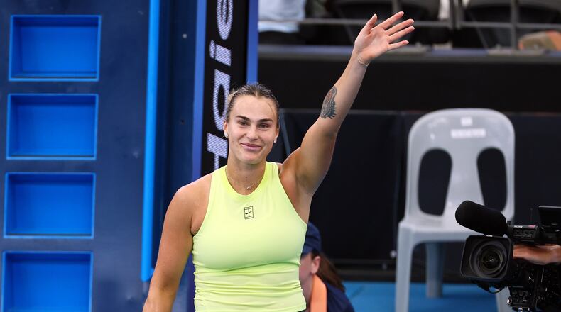 Aryna Sabalenka, of Belarus waves at the crowd after she won her semifinal match against Karolína Muchova, of the Czech Republic 6-3, 6-5, at the Brisbane International in Brisbane, Australia, Saturday, Jan. 10, 2026. (AP Photo/Tertius Pickard)