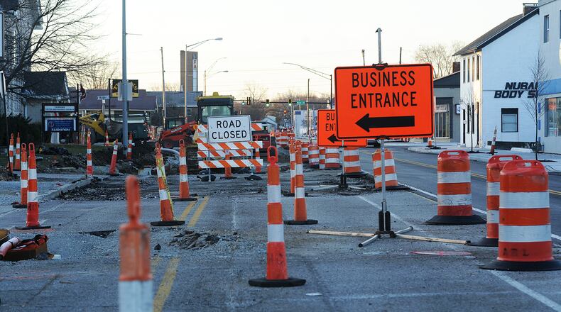 The work continues on Broad Street Wednesday, Dec. 20, 2023 in Fairborn. This project is among those funded with a 10-year, 0.25% income tax levy the city is seeking to renew next year. MARSHALL GORBY\STAFF