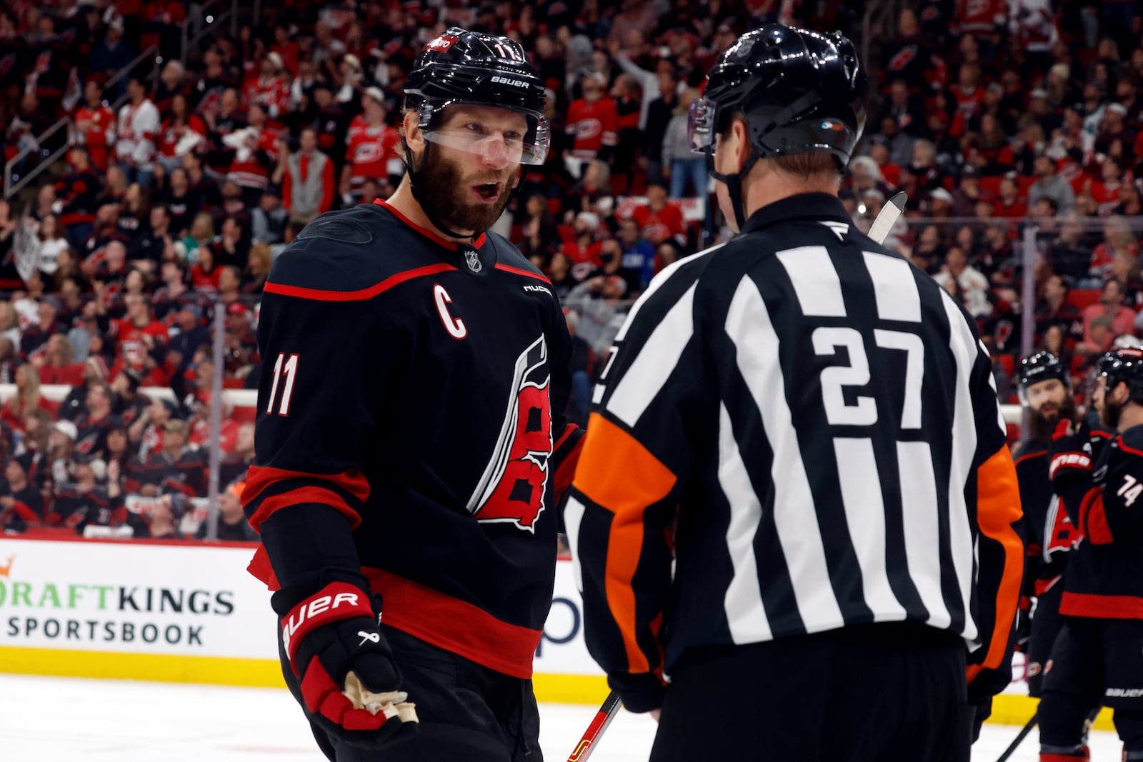Carolina Hurricanes' Jordan Staal (11) talks with an official about a call during the first period of Game 1 of the NHL hockey Stanley Cup Eastern Conference finals against the Florida Panthers in Raleigh, N.C., Tuesday, May 20, 2025. (AP Photo/Karl DeBlaker)