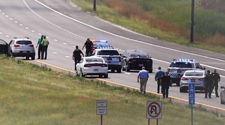An investigator from the Warren County Coroner’s Office is responding to a shooting reported on I-75 south near Austin Boulevard. MARSHALL GORBY/STAFF