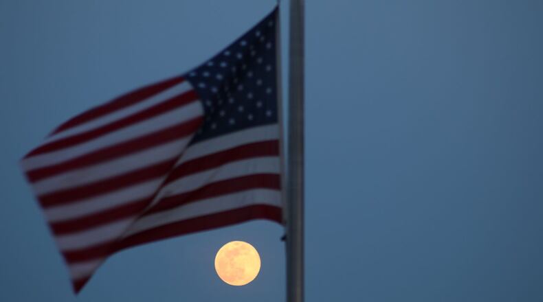 The super pink moon is seen over Eagle Rock Reservation Park in New Jersey on April 7, 2020.