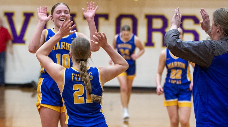Marion Local's Avae Unrast (10) and Audrey Winner (21) celebrate their victory in Thursday's Division IV regional semifinal at Butler High School. Jeff Gilbert/CONTRIBUTED