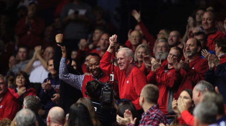 Johnny Davis, in his first return to UD Arena in over 20 years, sat with former head coach Don Donoher in the stands at the 2017 Flyers game. DAVID JABLONSKI / STAFF