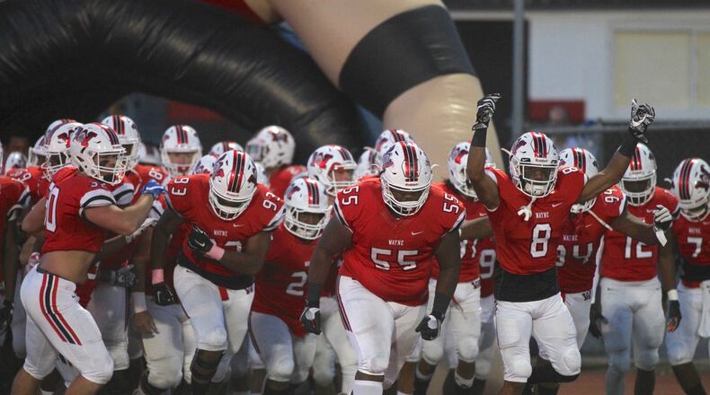 Wayne takes the field before a game against Springfield on Friday, Oct. 20, 2017, in Huber Heights. David Jablonski/Staff