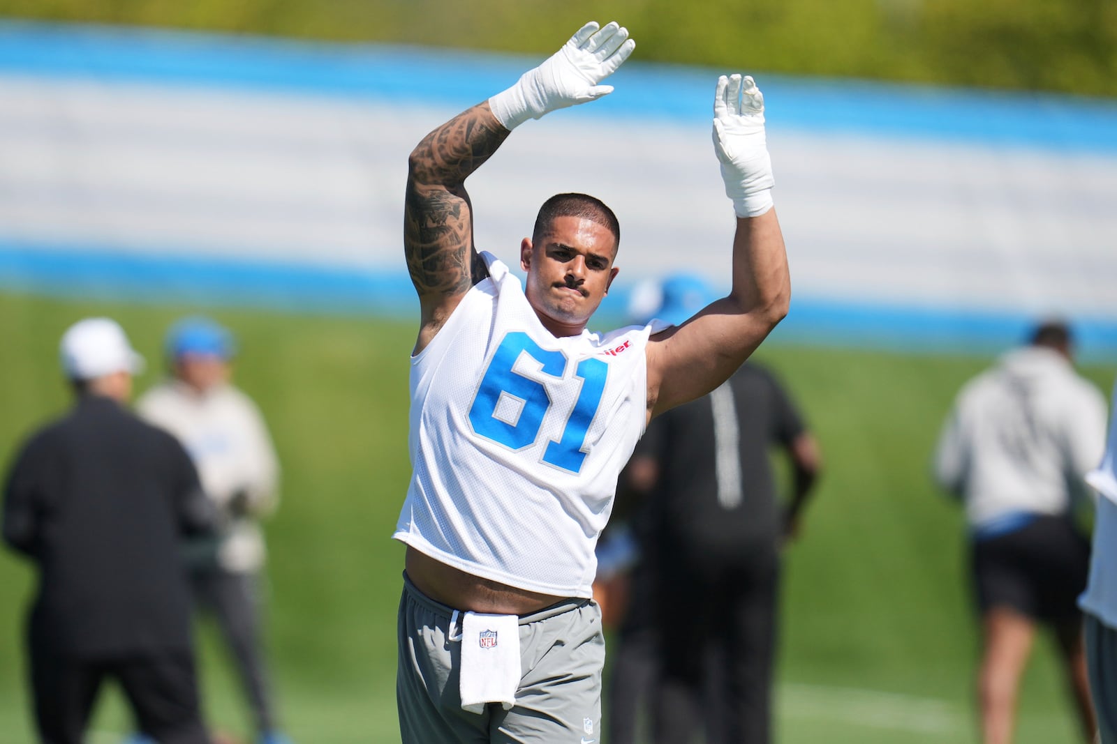 Detroit Lions defensive lineman Ahmed Hassanein (61) stretches during the NFL football team's rookie minicamp in Allen Park, Mich., Friday, May 9, 2025. (AP Photo/Paul Sancya)