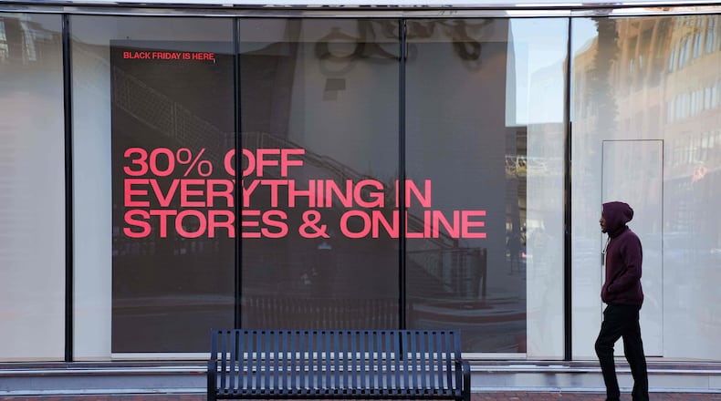 Shoppers browse for Black Friday deals at Atlantic Station outdoor mall, Friday, Nov. 28, 2025, in Atlanta, Ga. (AP Photo/Megan Varner)