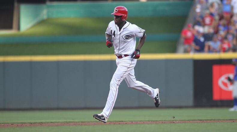The Reds’ Aristides Aquino rounds the bases after a two-run home run in the second inning against the Cubs on Friday, Aug. 9, 2019, at Great American Ball Park in Cincinnati. David Jablonski/Staff