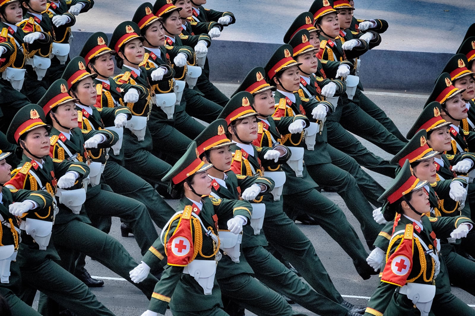 A Vietnamese women's medical unit marches during a military parade celebrating the 50th anniversary of the end of the Vietnam War on Wednesday, April 30, 2025, in Ho Chi Minh City, Vietnam. (AP Photo/Richard Vogel)