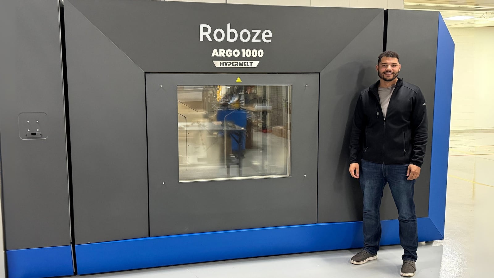 A CRG Defense employee with the ARGO HYPERMELT 3D printer. Contributed.