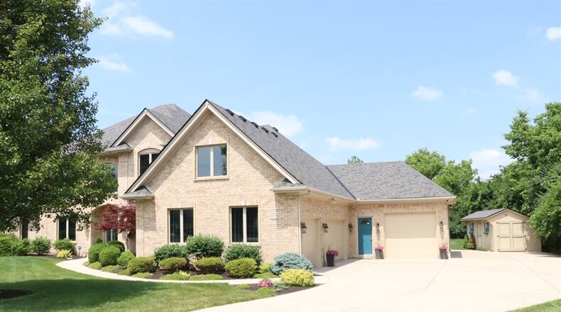 Listed for $799,986 by Berkshire Hathaway Home Services Professional Realty, the house at 7691 Deer Path Court has about 4,314 square feet of living space. CONTRIBUTED PHOTOS BY KATHY TYLER