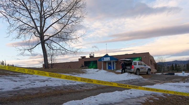 Police began putting tape out near the Tumbler Ridge Secondary School and surrounding buildings in Tumbler Ridge, B.C. on Wednesday, Feb. 11, 2026.(Jesse Boily /The Canadian Press via AP)