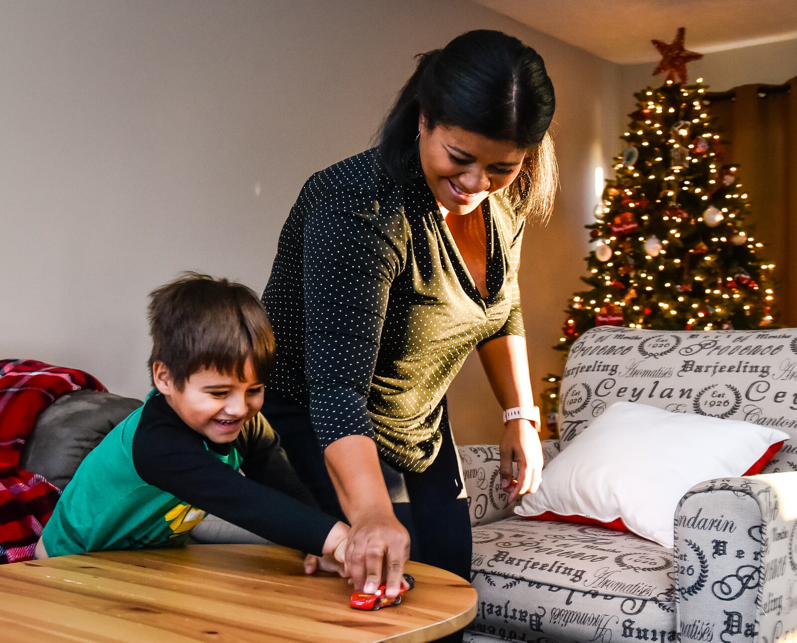 Sharon Reetz, of Monroe, made the decision to quit her job and stay at home with her son, Esteban, 3, and start her own business. NICK GRAHAM / STAFF