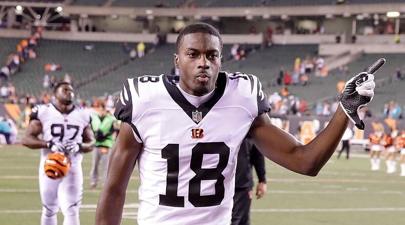 CINCINNATI, OH - SEPTEMBER 29: A.J. Green #18 of the Cincinnati Bengals celebrates while running off of the field after defeating the Miami Dolphins 22-7 at Paul Brown Stadium on September 29, 2016 in Cincinnati, Ohio. (Photo by Andy Lyons/Getty Images)