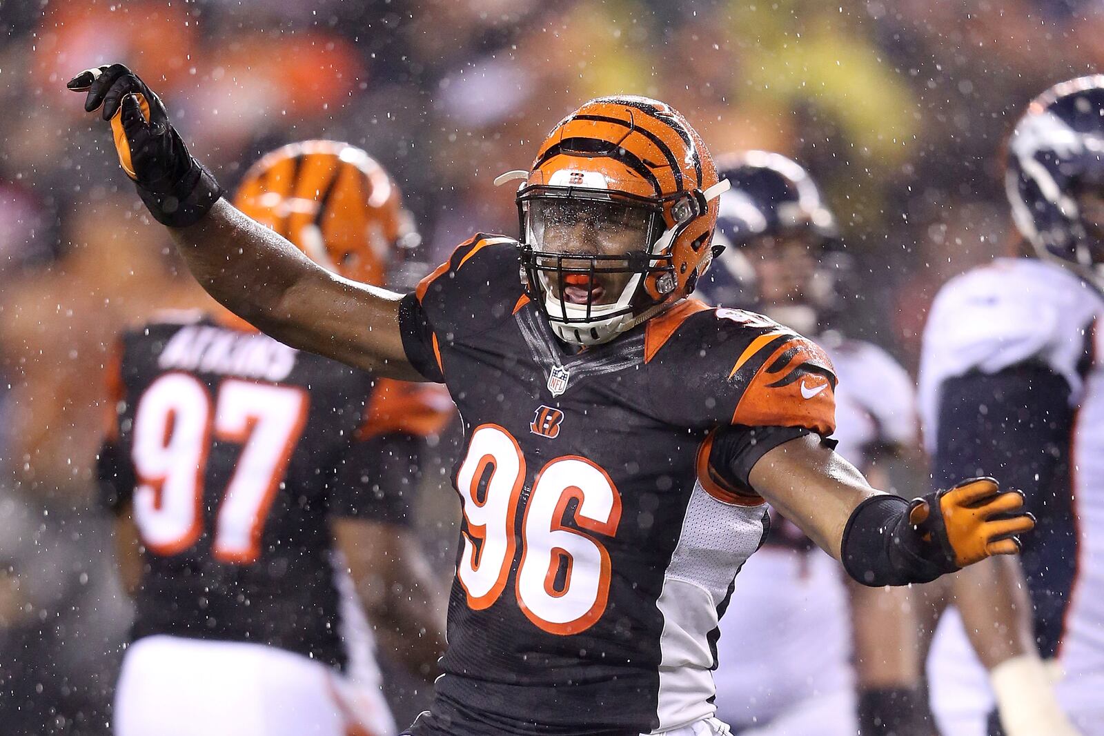 CINCINNATI, OH - DECEMBER 22: Carlos Dunlap #96 of the Cincinnati Bengals celebrates after sacking Peyton Manning #18 of the Denver Broncos during the fourth quarter at Paul Brown Stadium on December 22, 2014 in Cincinnati, Ohio. Cincinnati defeated Denver 37-28. (Photo by Andy Lyons/Getty Images)