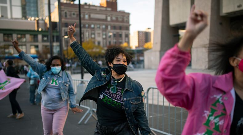 Members of Alpha Kappa Alpha, the first African-American sorority, of which Sen. Kamala Harris (D-Calif.) is a member, assemble at the Adam Clayton Jr. State Office Building in the Harlem neighborhood of New York on Saturday afternoon, Nov. 7, 2020. They celebrated Harris’s history-making vice presidency and performed a line dance. (Gregg Vigliotti/The New York Times)