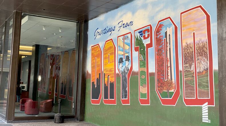 The latest downtown mural, created by artist Erica Arndts,l sends greetings to the community from Stratacache Tower.LISA POWELL / STAFF