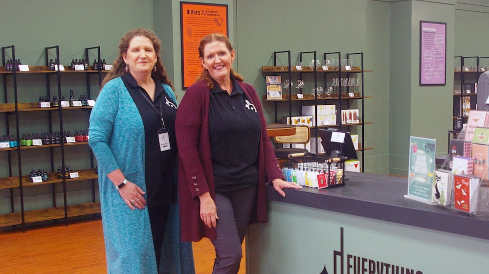 Sisters Michelle Juergens and Krista Hepp are the co-owners of Everything But the Bottle in the Bridgewater Falls shopping center in Fairfield Twp. SUE KIESEWETTER/CONTRIBUTED