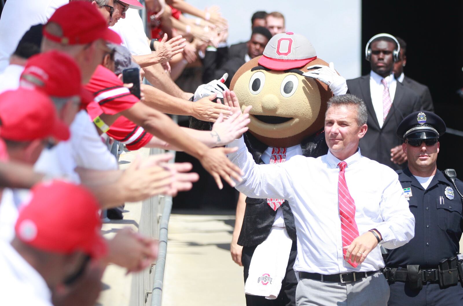 Ohio State's Urban Meyer walks to a game against Tulsa on Saturday, Sept. 10, 2016, at Ohio Stadium in Columbus. David Jablonski/Staff