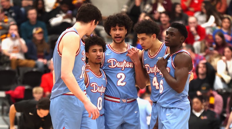 Dayton players huddle during a game against Loyola Chicago on Friday, March 1, 2024, at Gentile Arena in Chicago. David Jablonski/Staff