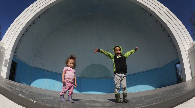 One-year-old Bellamy, left, and her brother, 4-year-old Brandon Vaughen, play inside the Island MetroPark bandshell Monday, March 11, 2024, during a family walk. MARSHALL GORBY\STAFF