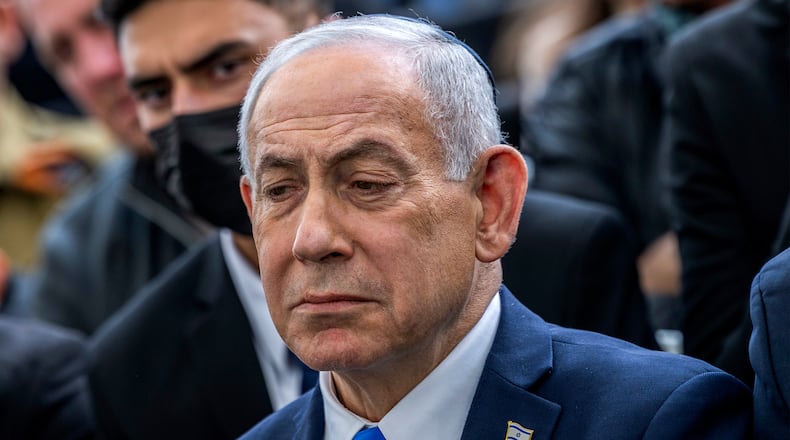 Israel's Prime Minister Benjamin Netanyahu reacts during the funeral of Israeli hostage Ran Gvili, whose remains were brought back to Israel, in the southern town of Meitar on Wednesday, Jan. 28, 2026.(Chaim Goldberg/Pool Photo via AP)