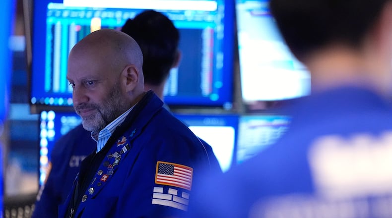 Meric Greenbaum works on the floor at the New York Stock Exchange in New York, Friday, March 6, 2026. (AP Photo/Seth Wenig)