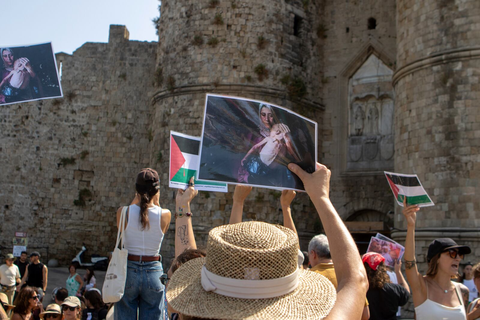 Pro-Palestinian protesters gather during the departure of a cruise ship carrying Israeli tourists on the southeastern Aegean Sea island of Rhodes, Greece, Monday, July 28, 2025. (InTime News via AP)