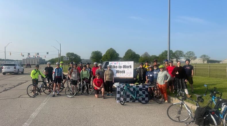 Employees at Wright-Patterson Air Force, celebrating a chance to bike to work, near gate 1B off Springfield Street early Tuesday. Photo by Maj. Michael Ford.