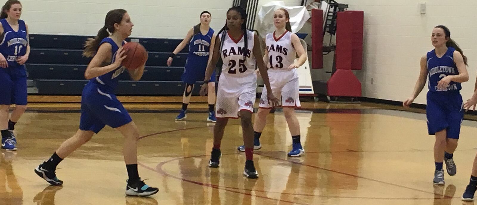 Middletown Christian’s Marissa Lykins (1) looks to make a pass to teammate Hannah Sponsel (2) as Miami Valley’s Taylor Felder (25) and Eva Lyon (13) defend Thursday night at Lane Gymnasium in Washington Township. RICK CASSANO/STAFF