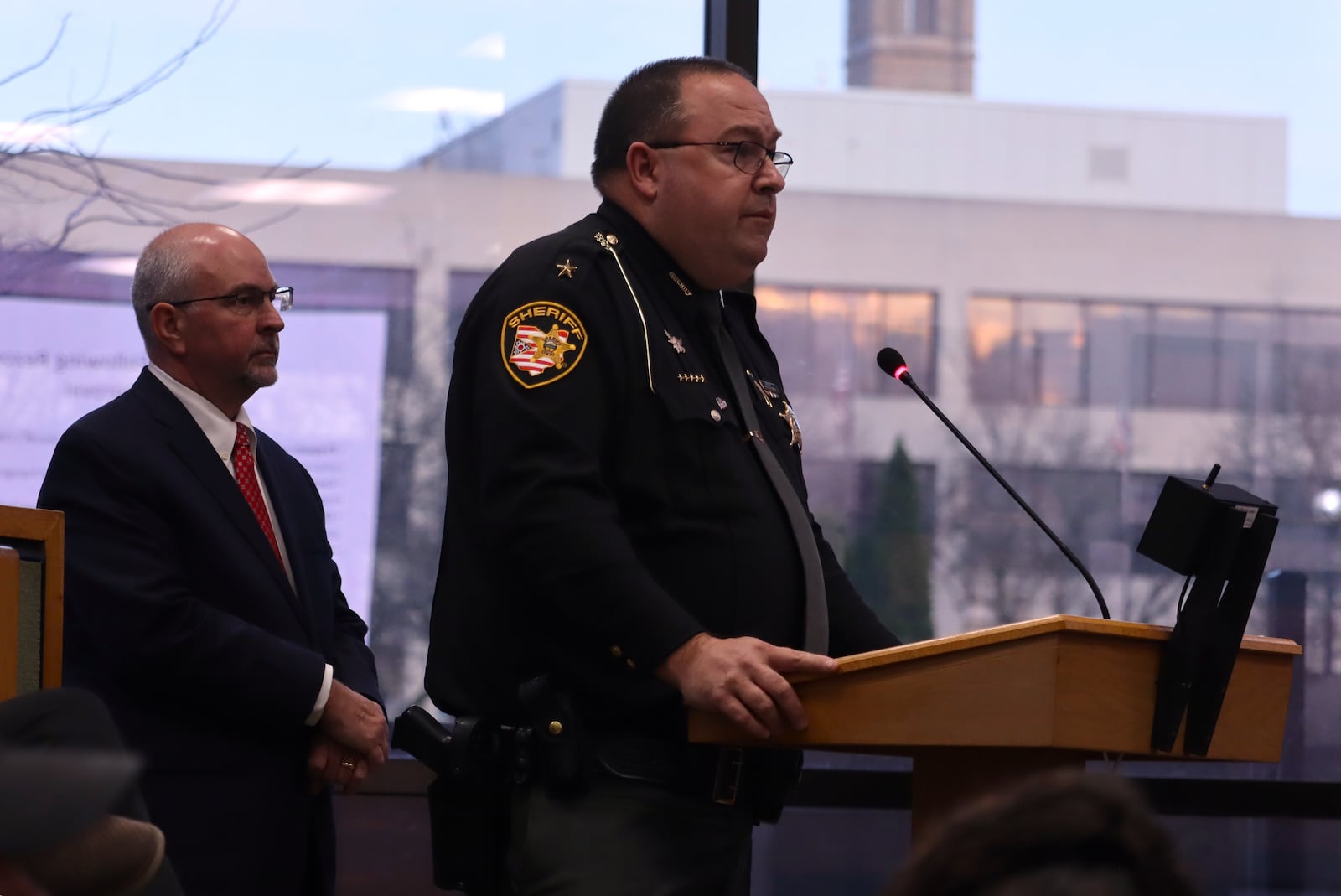 Clark County Sheriff Chris Clark (front) talks about the proposed public safety building at a rezoning hearing in front of Springfield City Commission with Clark County Commissioner Charles Patterson Tuesday, March 10, 2026. JESSICA OROZCO/STAFF