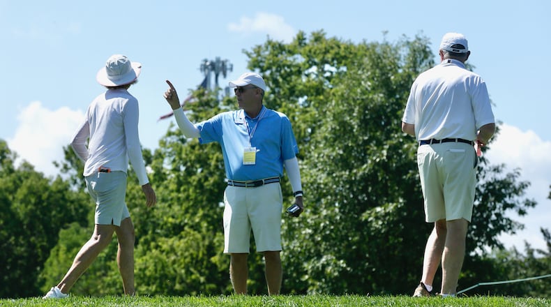 Beavercreek's Ken Herr, a volunteer starter on the first hole for the U.S. Women's Senior Open at NCR Country Club, helps golfers during a practice round on Tuesday, Aug. 23, 2022, in Kettering. David Jablonski/Staff