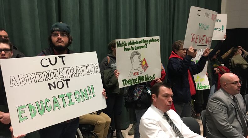 FILE: Wright State University students protested on Friday, April 7, 2017, before officials announced it will begin immediately cutting expenses campus wide to meets its goal of $25 million reduction goal. Students held signs, such as Release the Audit and Cut Administration Not Education, critical of the decisions. JOSH SWEIGART / STAFF