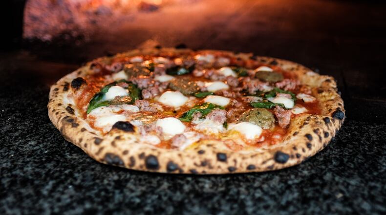 Old Scratch Pizza reopens its Dayton restaurant Tuesday, Aug. 25 after a brief closure due to employee's positive COVID-19 test. CONTRIBUTED