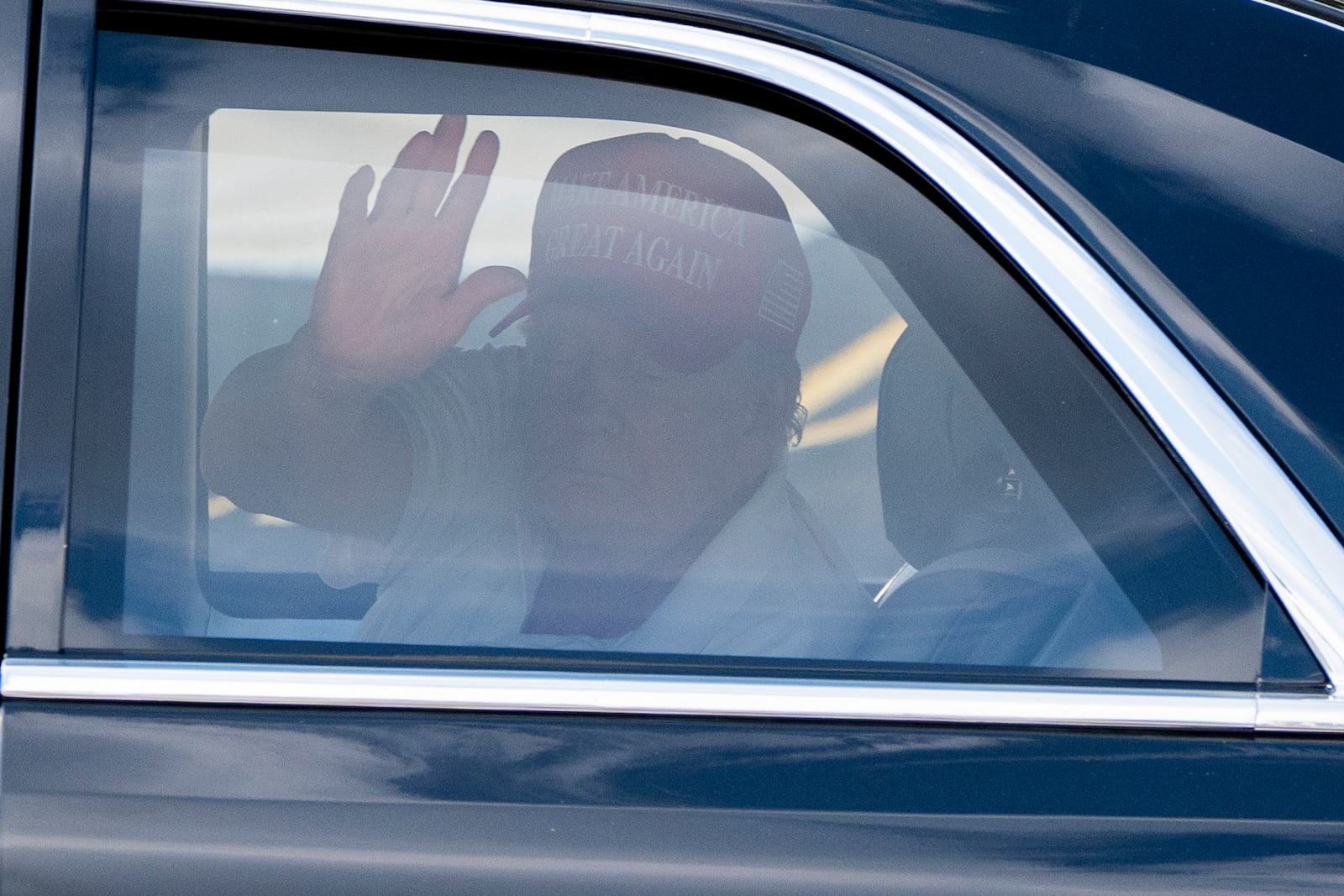 FILE - President Donald Trump waves as he departs in his motorcade from the Trump International Golf Club, March 1, 2025, in West Palm Beach, Fla. (AP Photo/Alex Brandon, File)