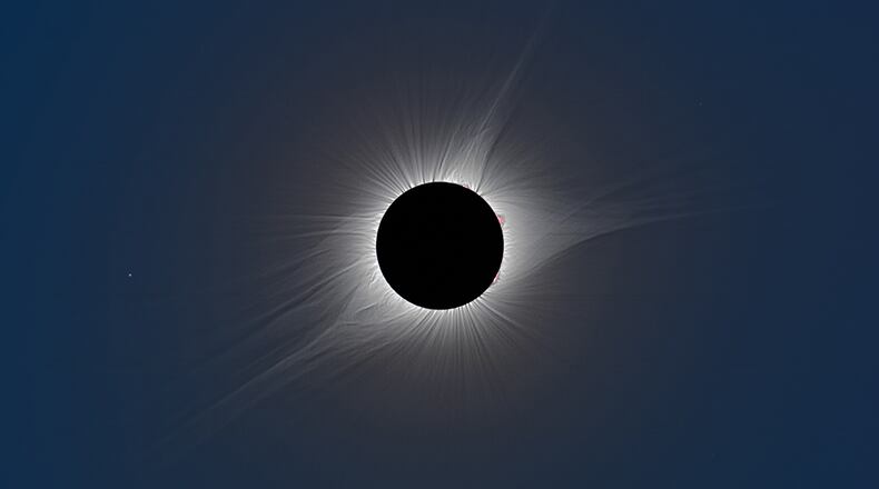 The total phase of the Aug. 21, 2017, solar eclipse as seen from Madras, Oregon. This is a composite of short, medium, and long exposures, as no single exposure can capture the huge range of brightness exhibited by the solar corona. The star to the left (east) of the eclipsed sun is Regulus, the brightest star in the constellation Leo. NASA/Courtesy Rick Fienberg / TravelQuest International; additional processing by Sean Walker, Sky & Telescope.