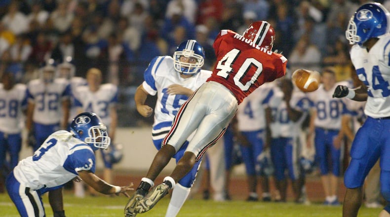 10-1-04 -- Wayne's #40 Mike Mickens blocked this field goal attempt by Xenia's David Wright late in the first quarter in Huber Heights. Ty Greenlees/DDN
