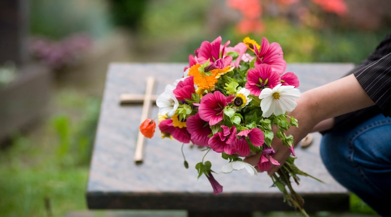 Losing a mother is sometimes especially hard on Mother's Day. There are some ways to honor her memory, including making charitable donations in her name, writing a letter to her, and placing flowers at her memorial site. ISTOCK PHOTO