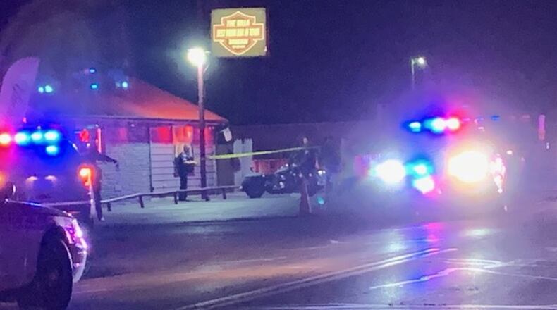Police closed off Rip Rap Road in Huber Heights Wednesday night after three people were wounded in shooting outside the Villa Tavern. STAFF/JIM NOELKER