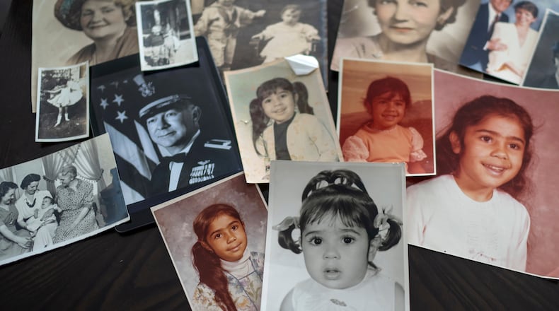 FILE - Childhood photos of a woman adopted as a toddler by an American war veteran, who he found in the 1970s in an Iranian orphanage and raised as a Christian, are displayed along with a picture of her father, a WWII Air Force veteran, at left, and additional family photos, Monday, June 24, 2024, in Henderson, Nev. (AP Photo/David Goldman, File)