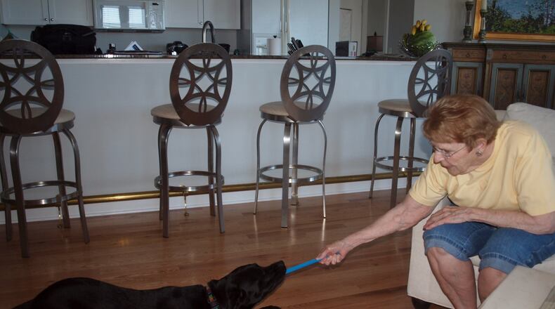 Teddy and his “grandmom” playing “fetch-shake-tug-chew.” KARIN SPICER/CONTRIBUTED