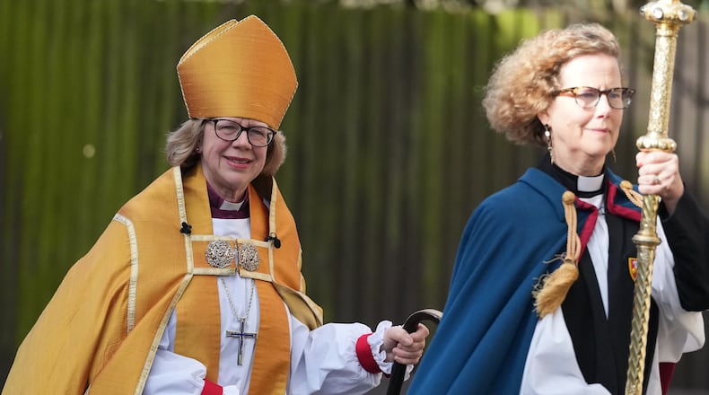Sarah Mullally, left, arrives for the Enthronement Ceremony installing her as archbishop of Canterbury in Canterbury, England, Wednesday, March 25, 2026, the first woman ever to lead the Church of England. (AP Photo/Alastair Grant)
