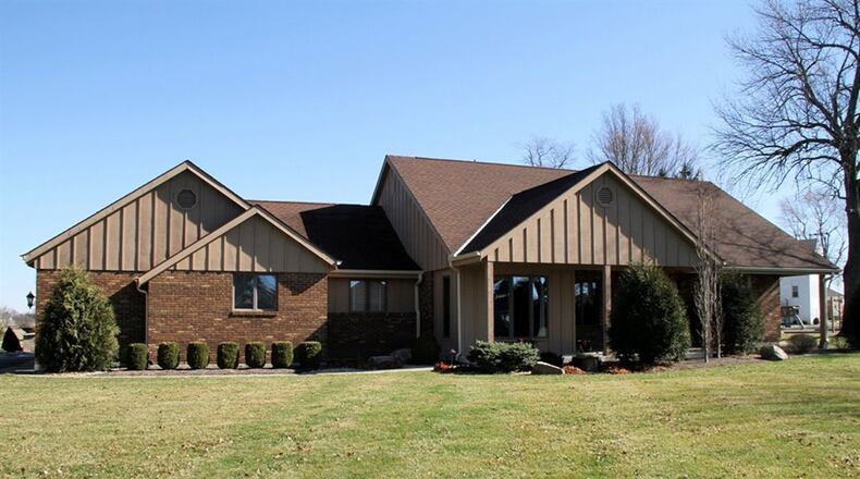 The brick ranch has about 2,425 sq. ft. of living space and is located just outside Pitsburg. The 1.79-acre property includes a 2-car, detached garage, a 1-car, detached garage with bonus room and covered porch, a storage shed and a courtyard-like patio. CONTRIBUTED PHOTOS BY KATHY TYLER