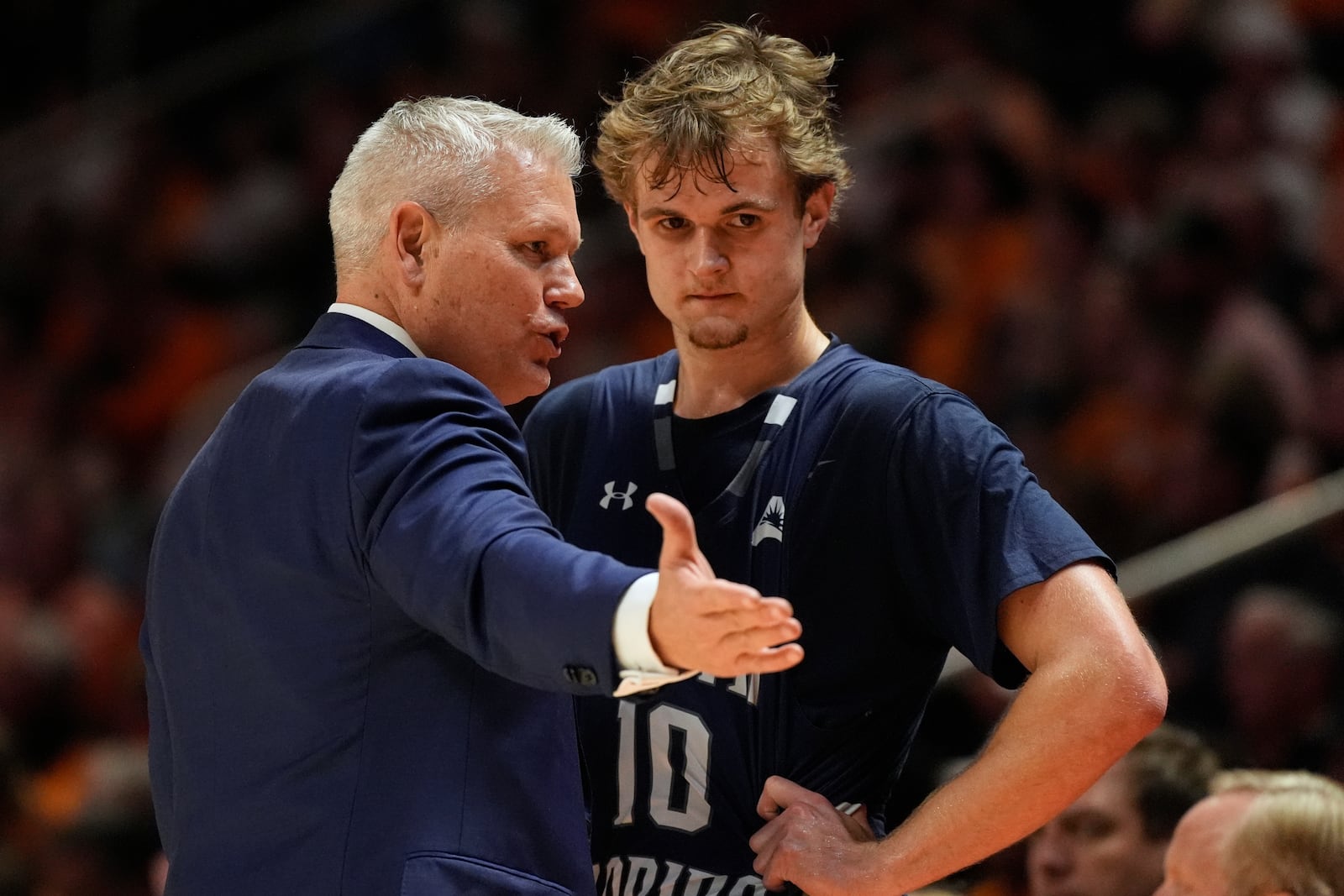North Florida head coach Bobby Kennen talks to guard Kent Jackson (10) during the second half of an NCAA college basketball game against Tennessee, Wednesday, Nov. 12, 2025, in Knoxville, Tenn. (AP Photo/George Walker IV)