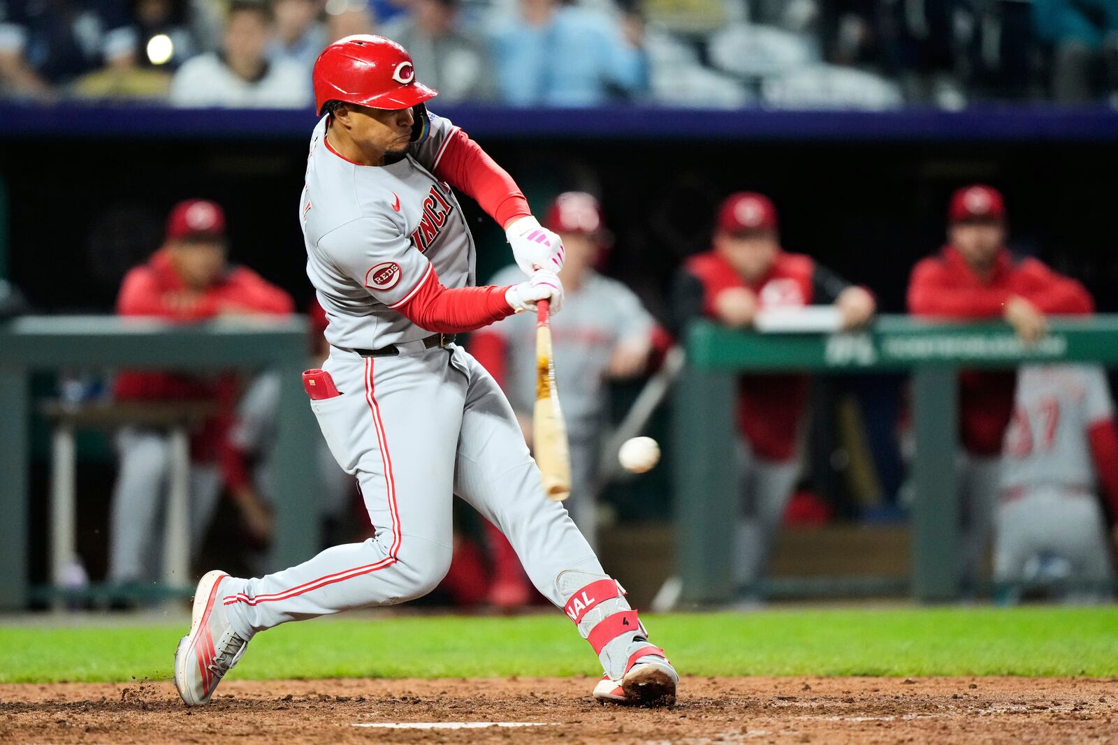 Cincinnati Reds' Santiago Espinal hits an RBI double during the ninth inning of a baseball game against the Kansas City Royals, Tuesday, May 27, 2025, in Kansas City, Mo. (AP Photo/Charlie Riedel)